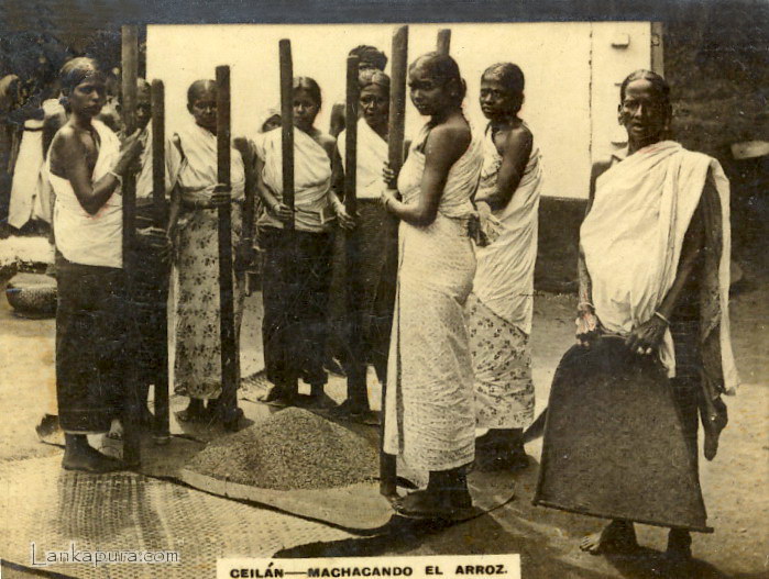 Pounding%20rice%20using%20a%20wooden%20p